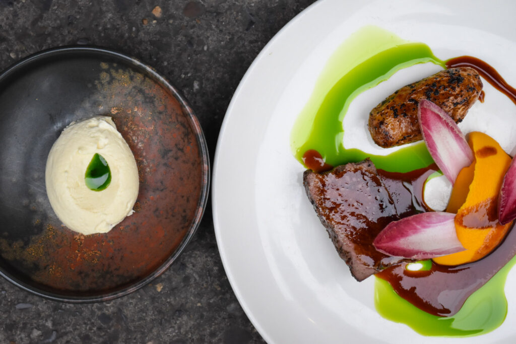 A photo of Damson Glazed Venison Loin, Wild Horseradish Cream, Vegemite Roasties, Pumpkin Miso Puree