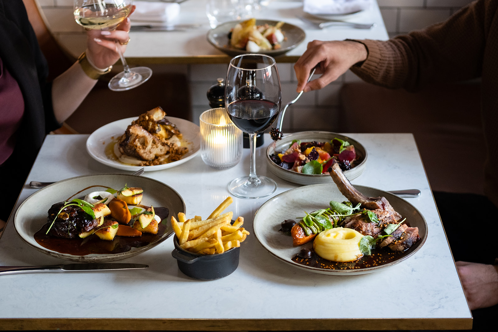 People are enjoying their meal with a glass of wine, Why Pichet is One of the Best Restaurants in Dublin