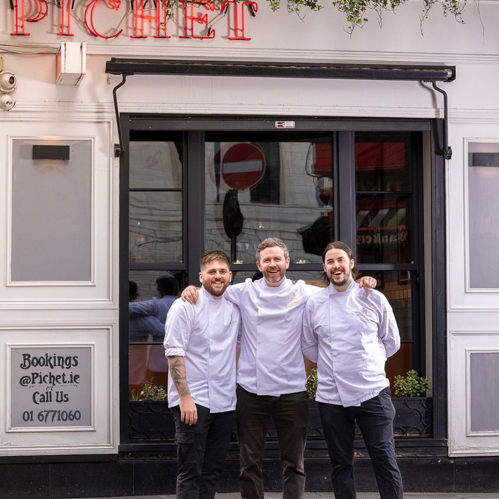 Chef Liam with other chefs outside Pichet